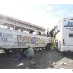 The aftermath of the "Ride the Ducks" and Bellair bus crash, with a person on the ground.