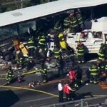 An aerial view of the "Ride the Ducks" crash scene, showing numerous firefighters at work.