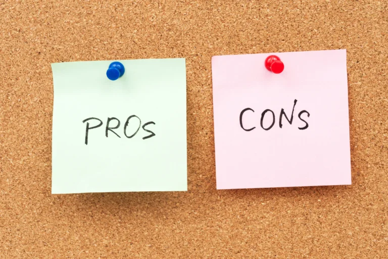 Two sticky notes pinned to a corkboard, one labeled "PROs" and the other labeled "CONs".
