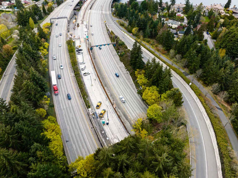 Traffic including a semi truck, and cars on I-90 freeway in Seattle Washington State.