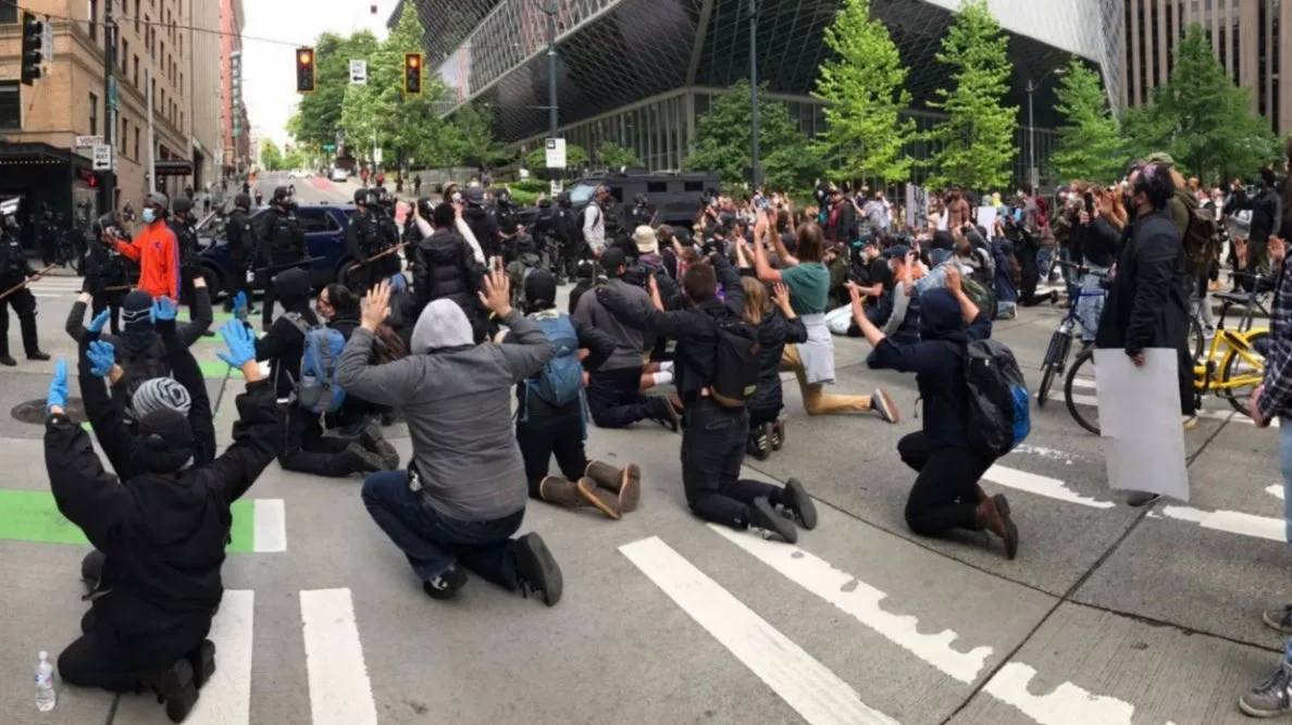 This image shows a protest scene in an urban area: