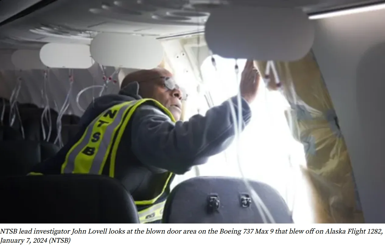 NTSB investigator examines missing door plug area on Boeing 737 MAX 9 involved in Alaska Airlines Flight 1282 blowout