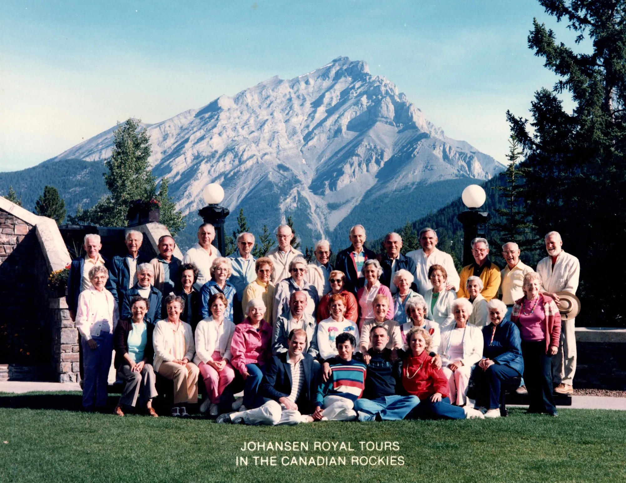 Group photo from Johansen Royal Tours with the Canadian Rockies in the background